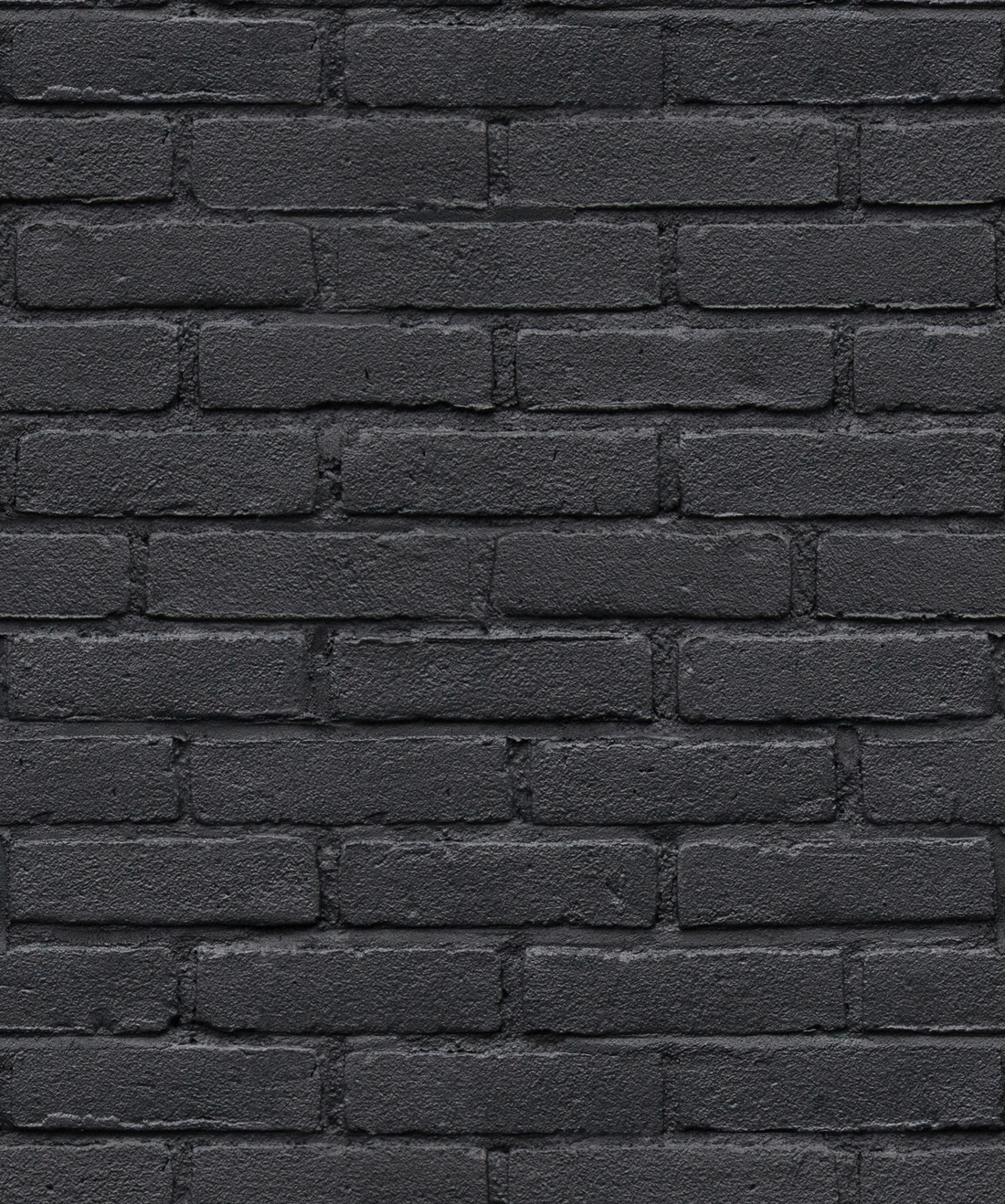Texture of a perfect black brick wall as background or wallpaper